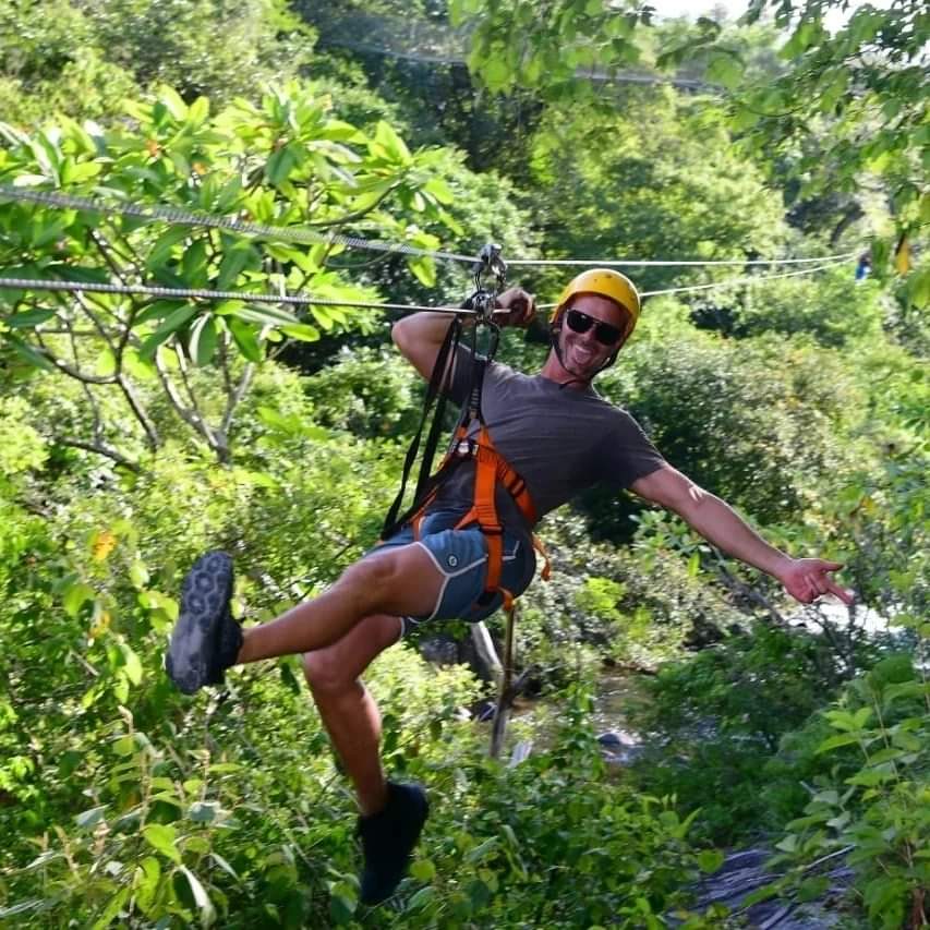 Happy client ziplining through the jungles of Guanacaste, Costa Rica