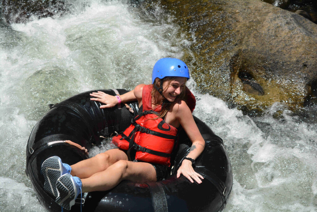 Girl Rafting Action Shot Cañon de la Vieja Rafting Cañon de la Vieja W Resort Costa Rica Brasilito Tours
